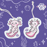 Top view of an eco-friendly cellulose pop-up kitchen sponge with a hanging cord, featuring a pattern of two adorable axolotls and engraved with the brand name "now pop up"—compact when dry and expanding when wet for cheerful cleaning