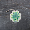 Meet your new kitchen essential - an eco-conscious pop-up sponge that transforms from slim to plump! This top-view reveals its beautiful leaf-print design on biodegradable cellulose. Complete with hanging cord, it smartly switches between space-saving dry mode (flat) and super-absorbent wet mode (expanded), making sustainable cleaning stylish and practical.