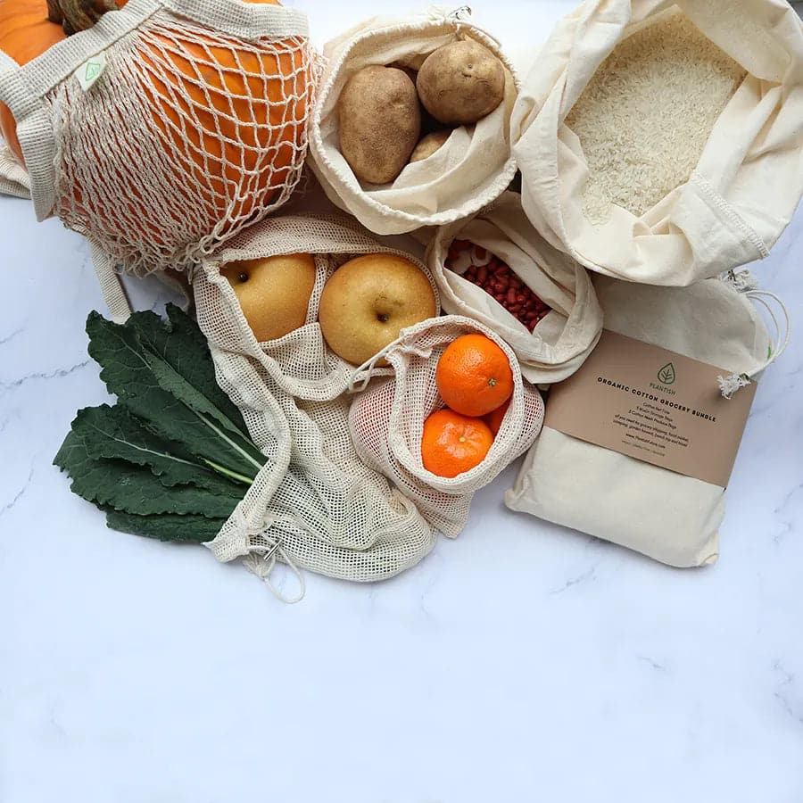 Variety of organic cotton produce bags for grocery shopping. Plastic free grocery bags.
