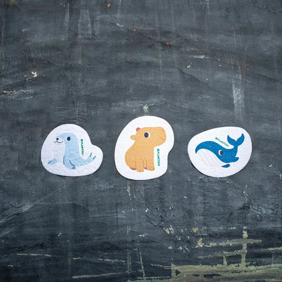 Set of 3 zero waste sea soaked pop up sponges featuring sea animals: Seal, Hippo, and Whale. Multi-use and eco-friendly.