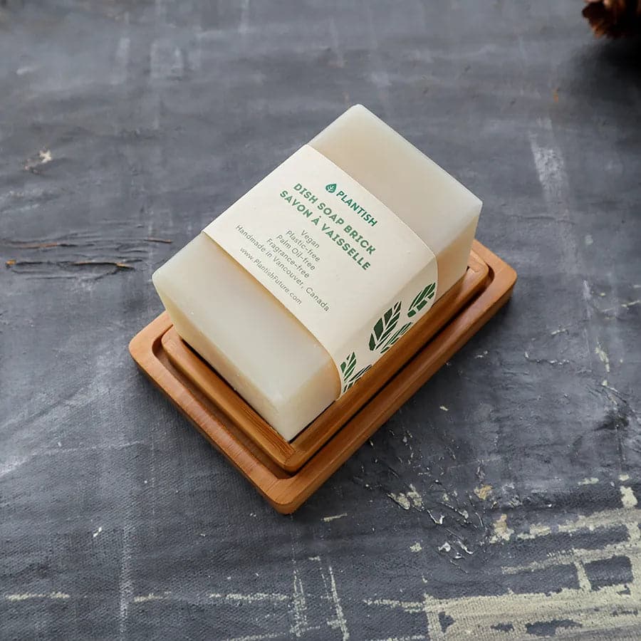 Our handmade soap brick resting on a natural bamboo soap holder - a beautiful and sustainable addition to the bathroom or kitchen.
