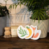 Set of 3 bestselling pop up sponges, solid dish soap brick and dish brush on kitchen counter.
