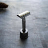 Plastic free metallic black safety razor kit with matching holder.