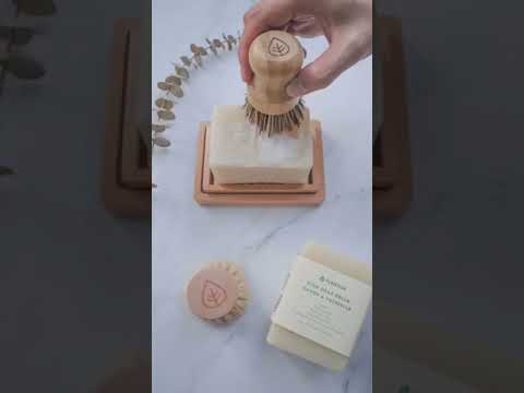Video of top view of pot scrubber creating foam with solid dish soap bar. Plastic free and eco friendly itchen cleaning essentials.