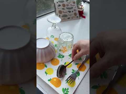 Video of eco friendly extra large orange dry mat as placemat in kitchen. 