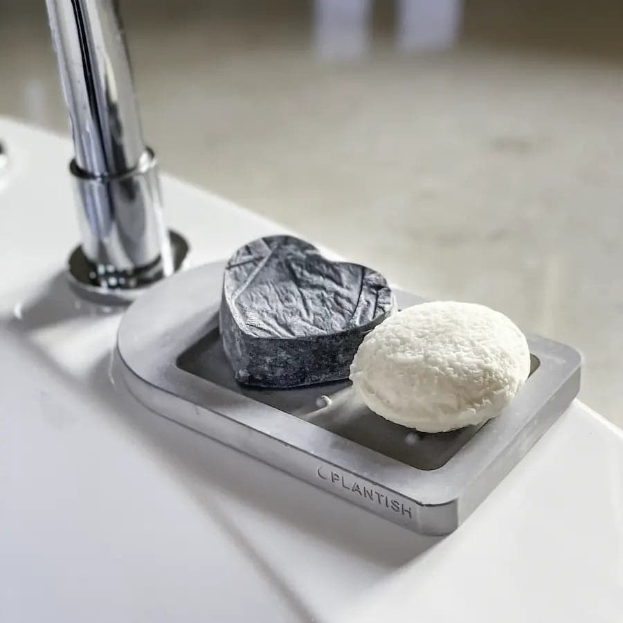 Rebalancing conditioner bar and hydrating shampoo bar on top of self drying soap dish.