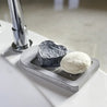 Rebalancing conditioner bar with hydrating shampoo bar on self drying soap dish.