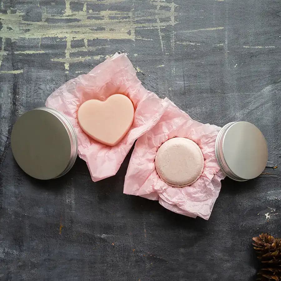 Nourishing shampoo and conditioner bar set in metal tins. Eco friendly and plastic free beauty set.