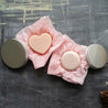 Nourishing shampoo and conditioner bar in metal tins.