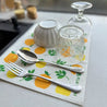 Orange reusable dish cloth as table mat. Eco friendly and plastic free.