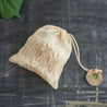 Cotton buds inside mini mesh bag with draw string. Eco friendly and plastic free storage alternative.
