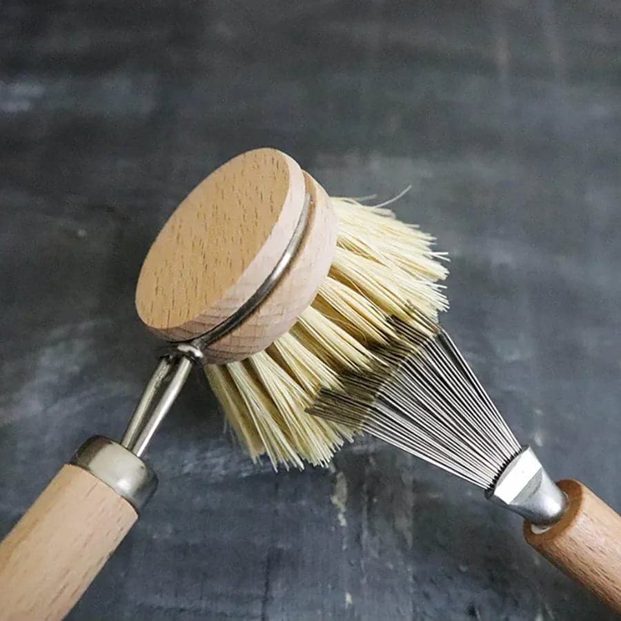  Brush cleaner combing through sisal bristles of sisal dish brush.