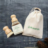 Organic cotton bag with drawstrings with sisal hand brush, sisal palm pot scrubber and solid dish soap bar.