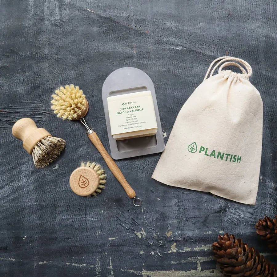 Organic cotton bag with drawstrings with self drying soap dish, sisal dish bruh with replacement dish brush head, and sisal and plam pot scrubber.